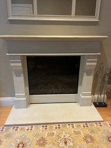 Limestone fireplace with gas fire