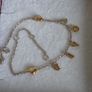 Pandora chain bracelet with gold yellow plated hearts, and dangle letters spelling LOVE adjustable closure with three length options: 16 cm, 18 cm, and 20 cm. In good condition few signs of wear. Image 9