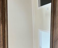 Dark brown wood mirror. Width 103cm Length 75cm