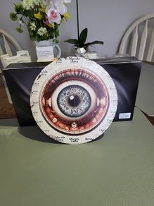 Metal plaque eye ball