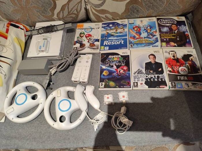 Wii bundle with Mario kart, Sports Resort, Mario Galaxy, Mario & Sonic Olympic