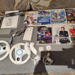 Wii bundle with Mario kart, Sports Resort, Mario Galaxy, Mario & Sonic Olympic