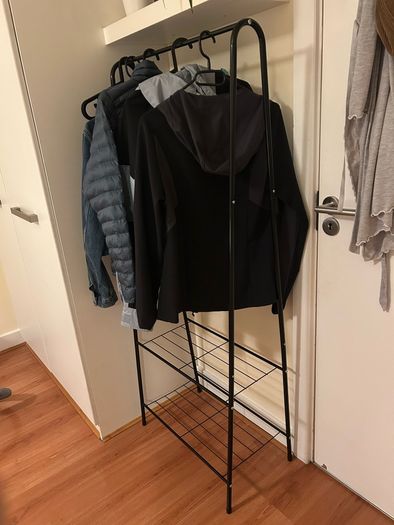 Black rack for clothes and shoes
