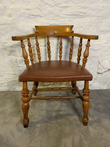 A large Victorian beech armchair.