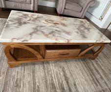Wooden coffee table with marble patterned resin top