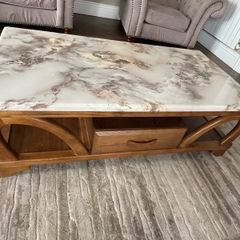 Wooden coffee table with marble patterned resin top