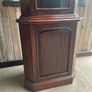 A tall mahogany corner cabinet. Image 5