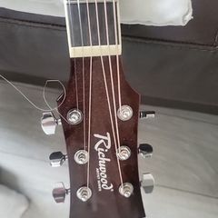 acoustic guitar and tuner