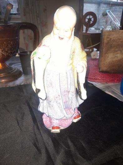 Beautiful Large Chinese Shou Xing porcelain figurine depicting the God of Longevity. It features an elderly man with a prominent bald head, holding a peach, which symbolizes long life, Postage Available, no chips or cracks