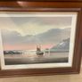 This artwork is a coastal oil painting featuring a traditional single-masted sailing boat stranded or anchored on a calm shoreline, signed by contemporary marine artist David James Image 5