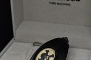 A Vivienne Westwood watch with gold face and leather strap