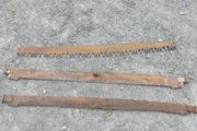Three vintage crosscut saw blades,