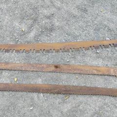 Thre vintage crosscut saw blades,