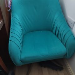 teal swivel chair with brass legs
