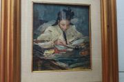 Oil painting of a girl reading at a desk