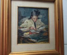 Oil painting of a girl reading at a desk