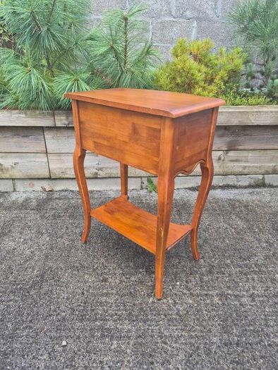 vintage French Provincial or Louis XV-style wooden bedside table/side chest featuring two drawers, cabriole legs, and a lower open shelf