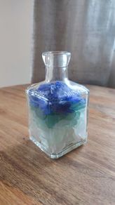 square bottle with sea glasses