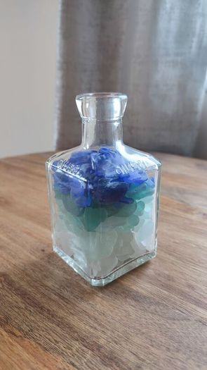 square bottle with sea glasses