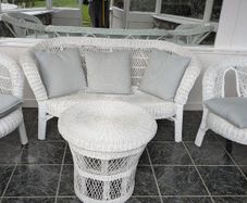 White wicker conservatory set - sofa, two chairs and table