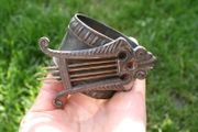 Antique napkin ring with harp