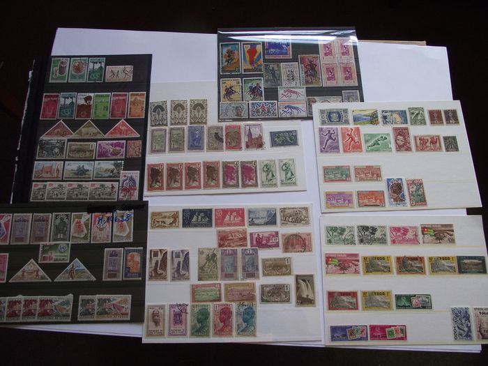 The collection of old stamps from French colonies on stock cards