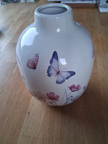 Ceramic vase with butterfly and floral design