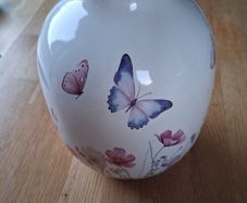 Ceramic vase with butterfly and floral design