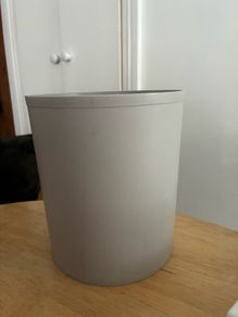 Compact grey trash can