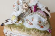 A Statue of Rococo lovers on a bench