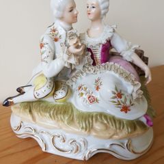 A Statue of Rococo lovers on a bench