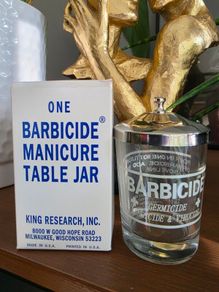 One barbicide manicure table jar