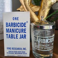 One barbicide manicure table jar