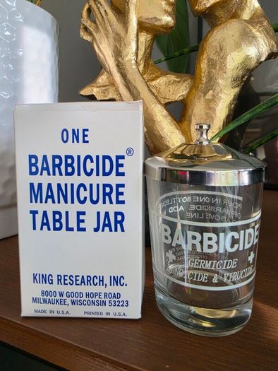 One barbicide manicure table jar