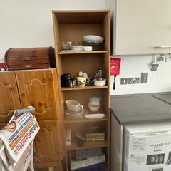 Tall wooden shelving unit