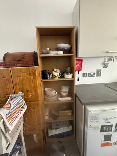 Tall wooden shelving unit