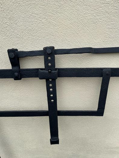 Antique iron crane for fireplace
