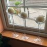 Set of 3 clear glass stemmed candle holders with ivory candles Image 3