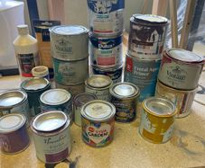 Open tins of paint and new painting products