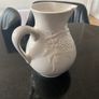 Vintage ceramic pitcher with embossed decoration Image 4