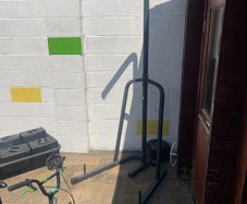 punch bag, stand and weight plates