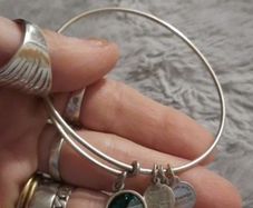 silver Alex and ani bracelet with emerald stone