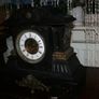 Victorian French Black Slate Mantle Clock (Very large and heavy) with bronze ornamentation Oversized. Open escarpment slate plate Roman numerals. Circa 1890s. Accented with Trojan head. Flanked by two Hellenistic ladies heads on sides. Rose cartouche mask Image 7