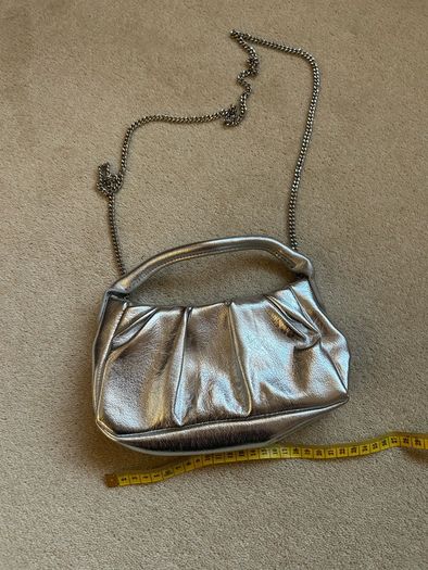 New silver mango clutch