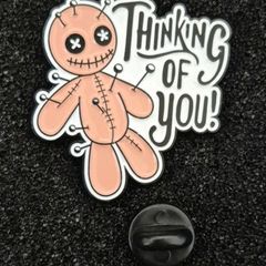 Thinking of you , pin back badge.