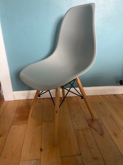 Chairs- modern molded plastic side chair with a minimalist Scandinavian-inspired design.