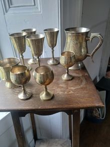 collection of silver plated goblets and tankard