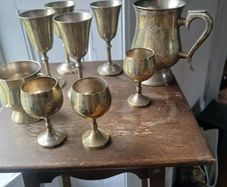 collection of silver plated goblets and tankard