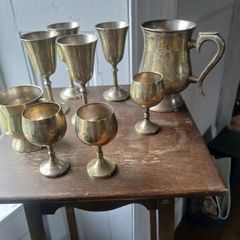 collection of silver plated goblets and tankard