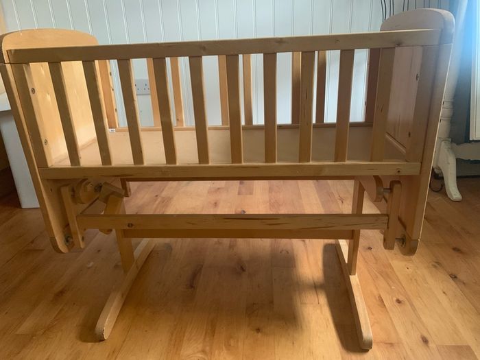 Handcrafted wooden rocking cot
